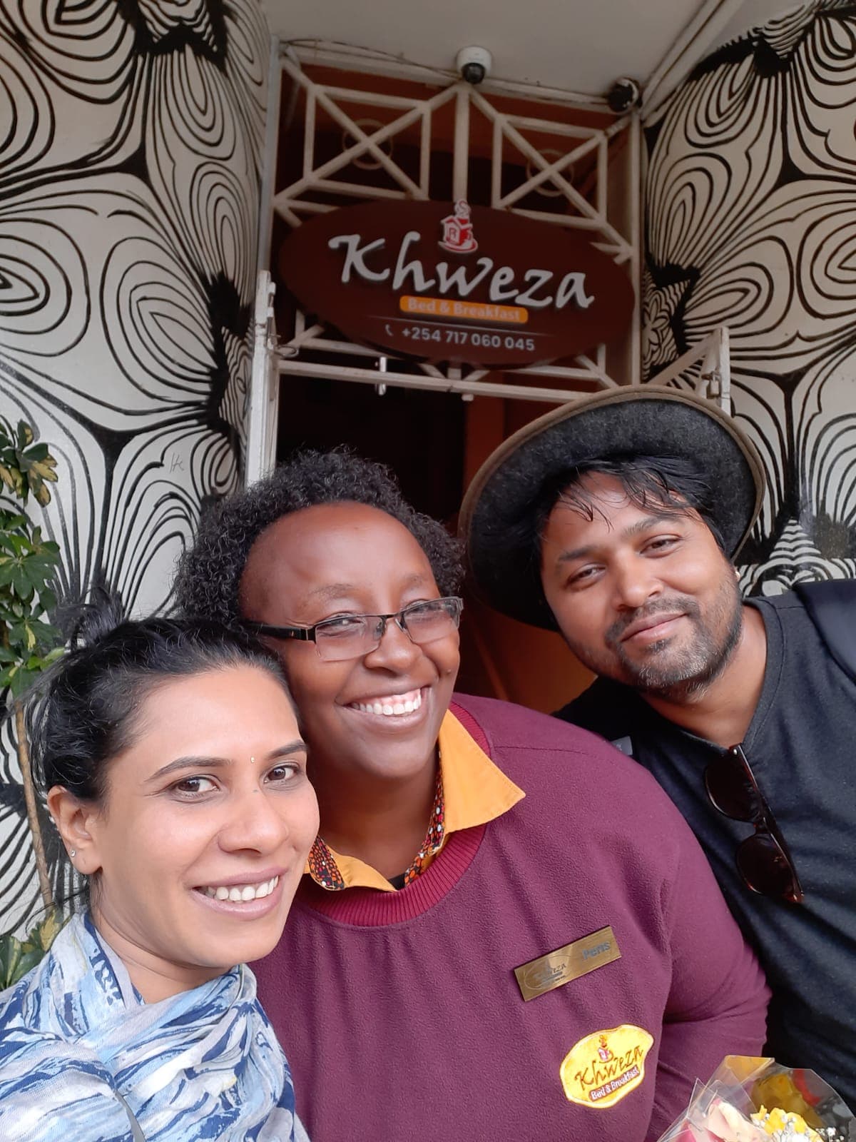 Guests taking a selfie with Khweza staff outside the Khweza office